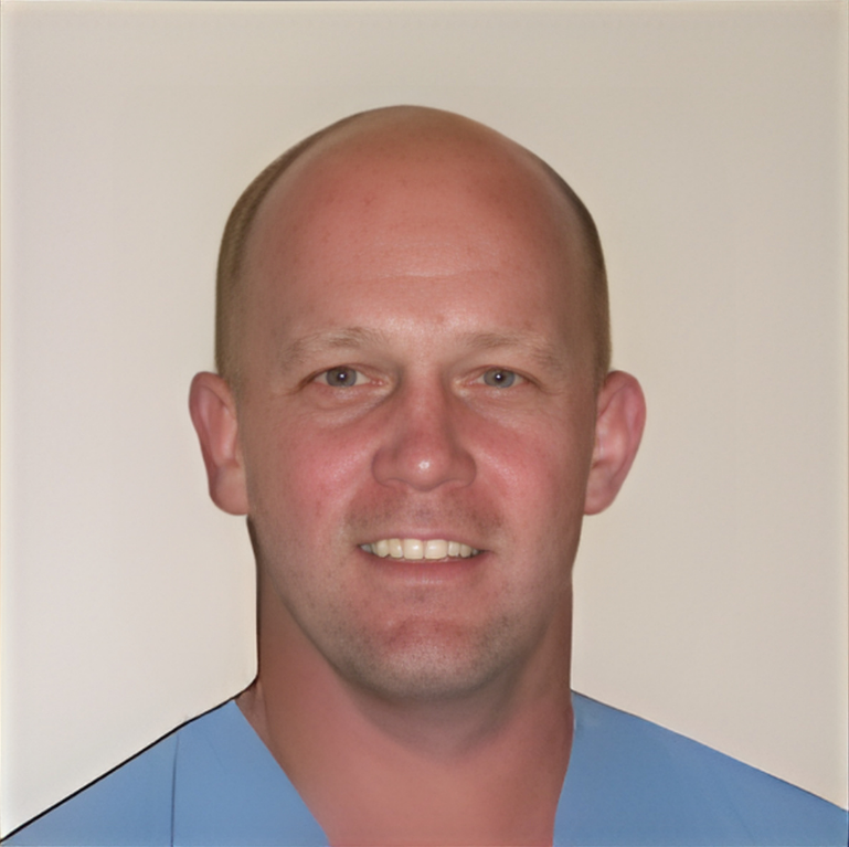 A smiling doctor in a lab coat with a stethoscope around his neck.