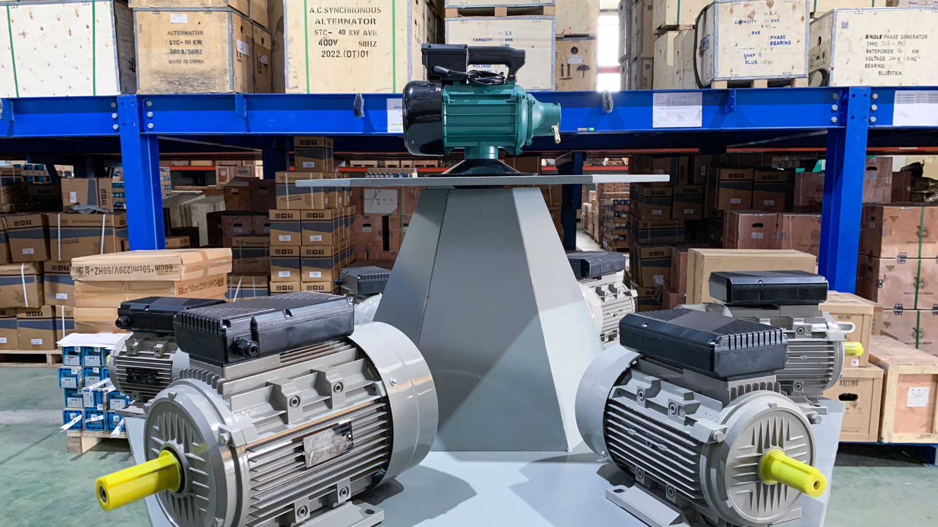 Two motors are sitting on top of each other in a warehouse.