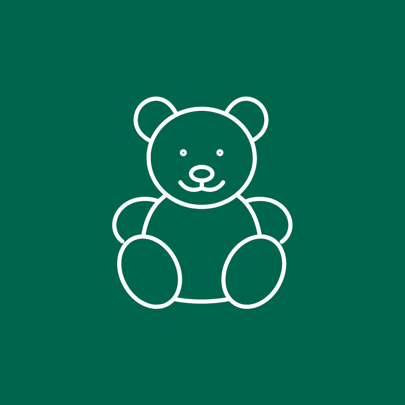 a white line drawing of a teddy bear on a green background .