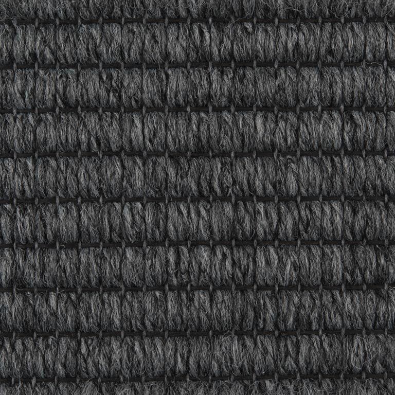 A close up of a gray carpet texture.