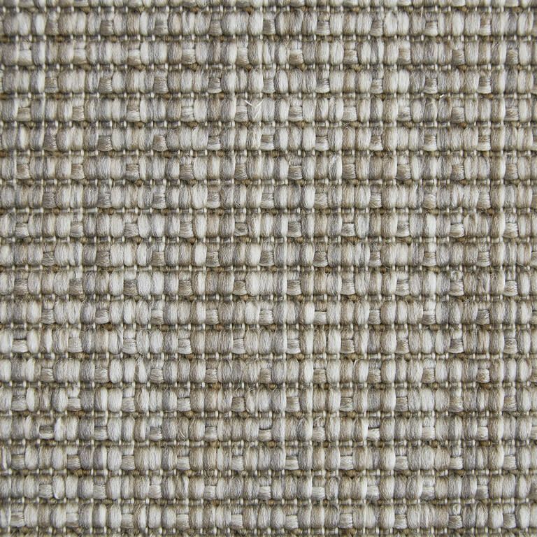 A close up of a gray and white fabric texture.