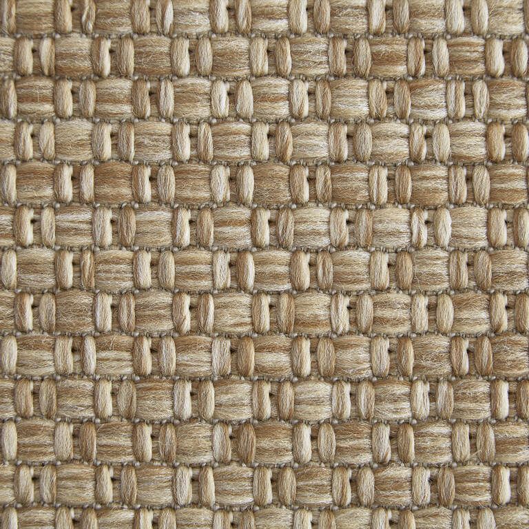 A close up of a rug with a woven pattern