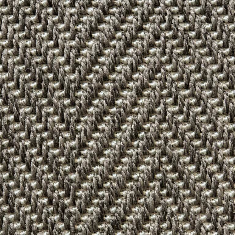 A close up of a knitted fabric with a geometric pattern.