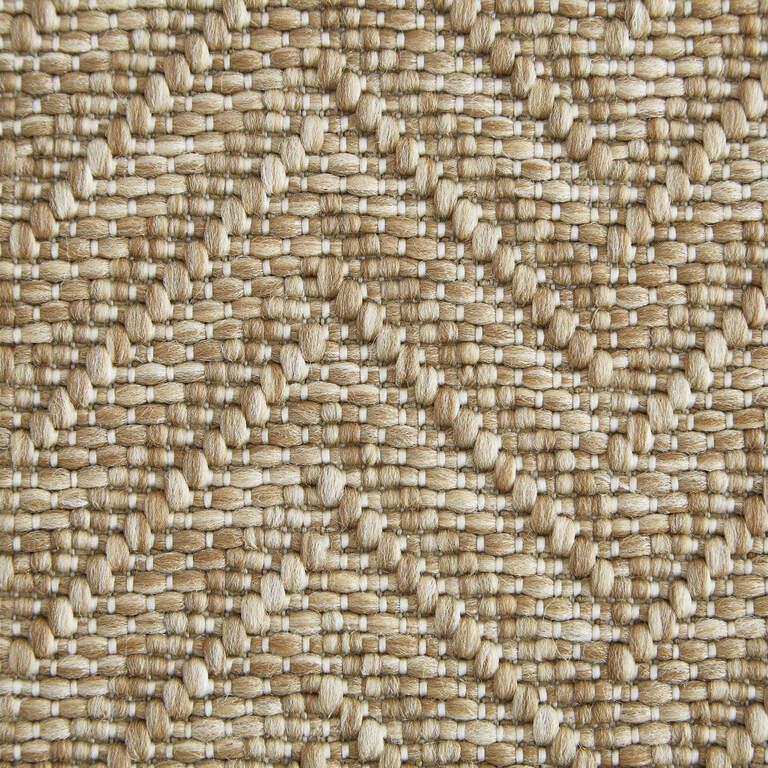 A close up of a woven fabric with a geometric pattern