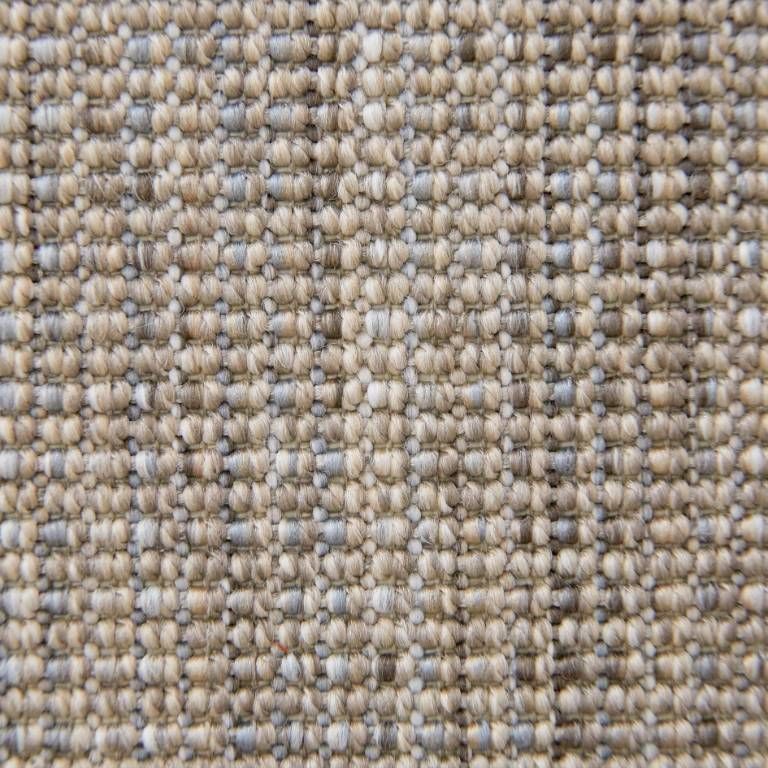 A close up of a carpet with a pattern on it.