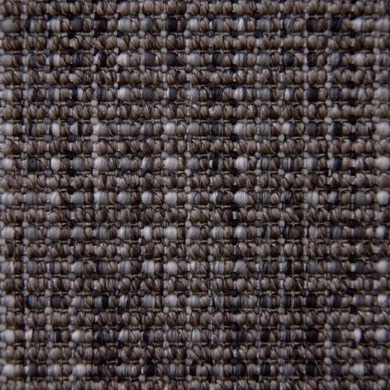 A close up of a carpet with a gray and white pattern