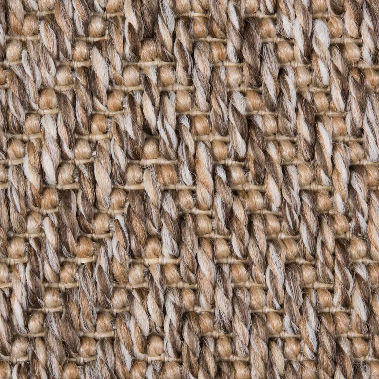 A close up of a brown and white carpet texture