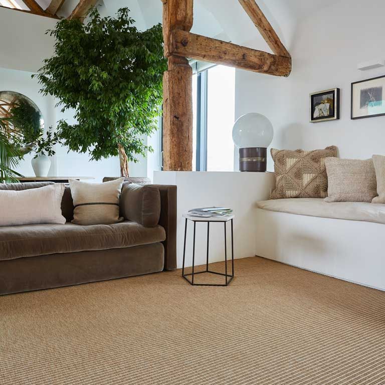 A living room with a couch and a table