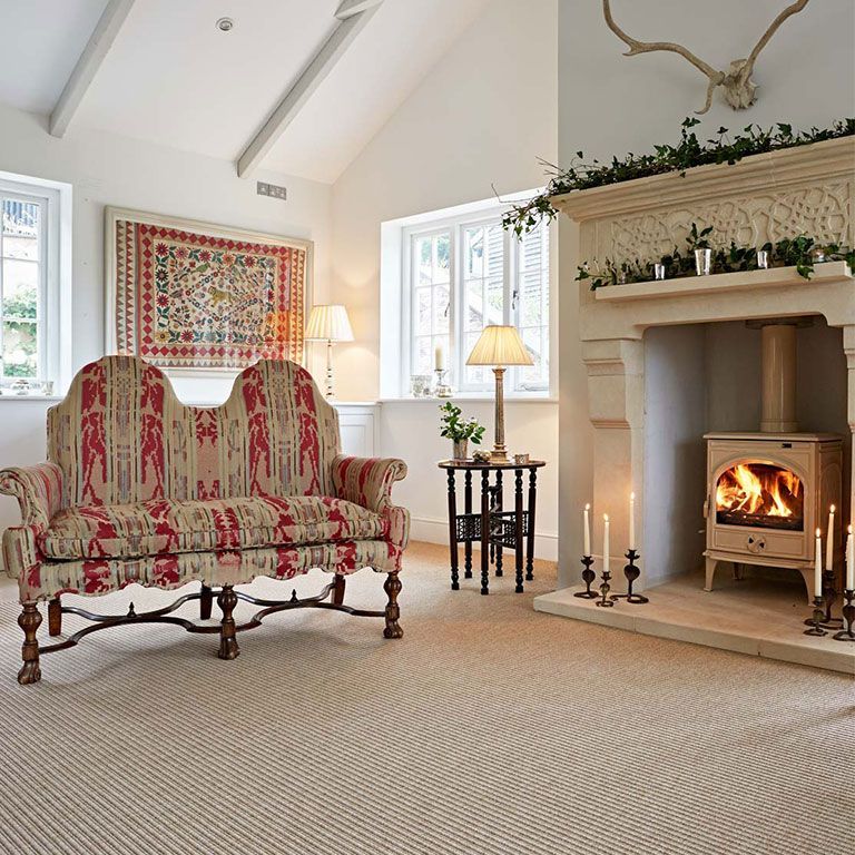 A living room with a fireplace and a couch