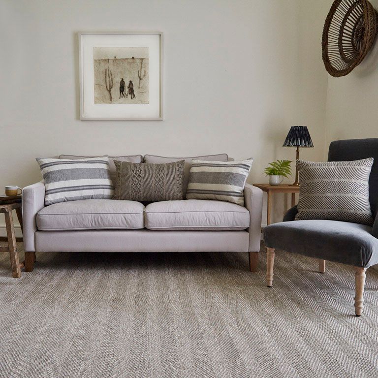 A living room with a couch and a chair