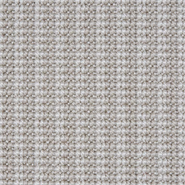 A close up of a white carpet texture.