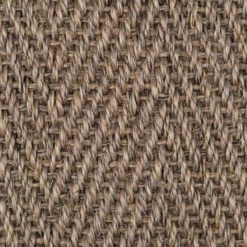 A close up of a brown carpet with a herringbone pattern.