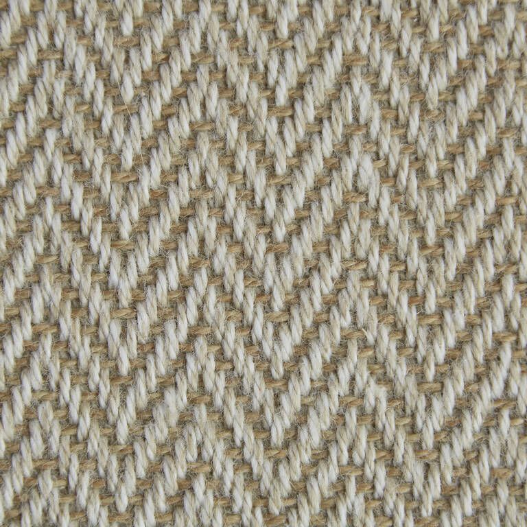 A close up of a fabric with a herringbone pattern