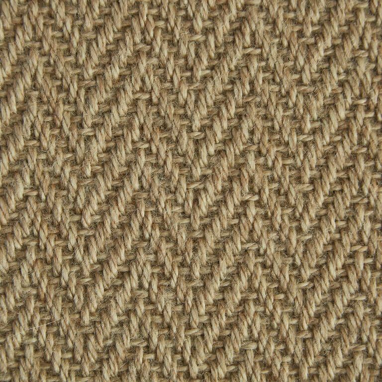 A close up of a knitted fabric with a herringbone pattern