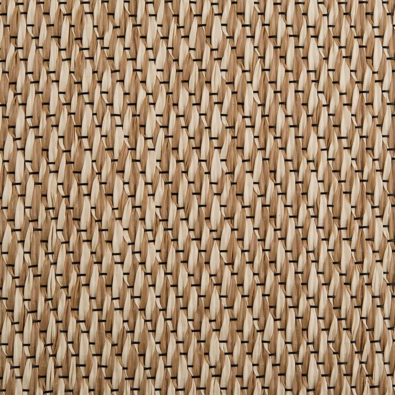 A close up of a wicker rug with a geometric pattern.