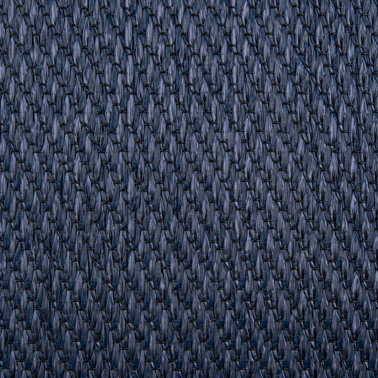 A close up of a blue fabric with a geometric pattern.