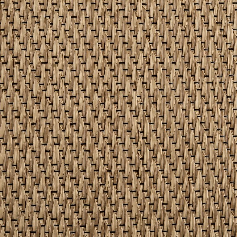 A close up of a wicker carpet with a geometric pattern.