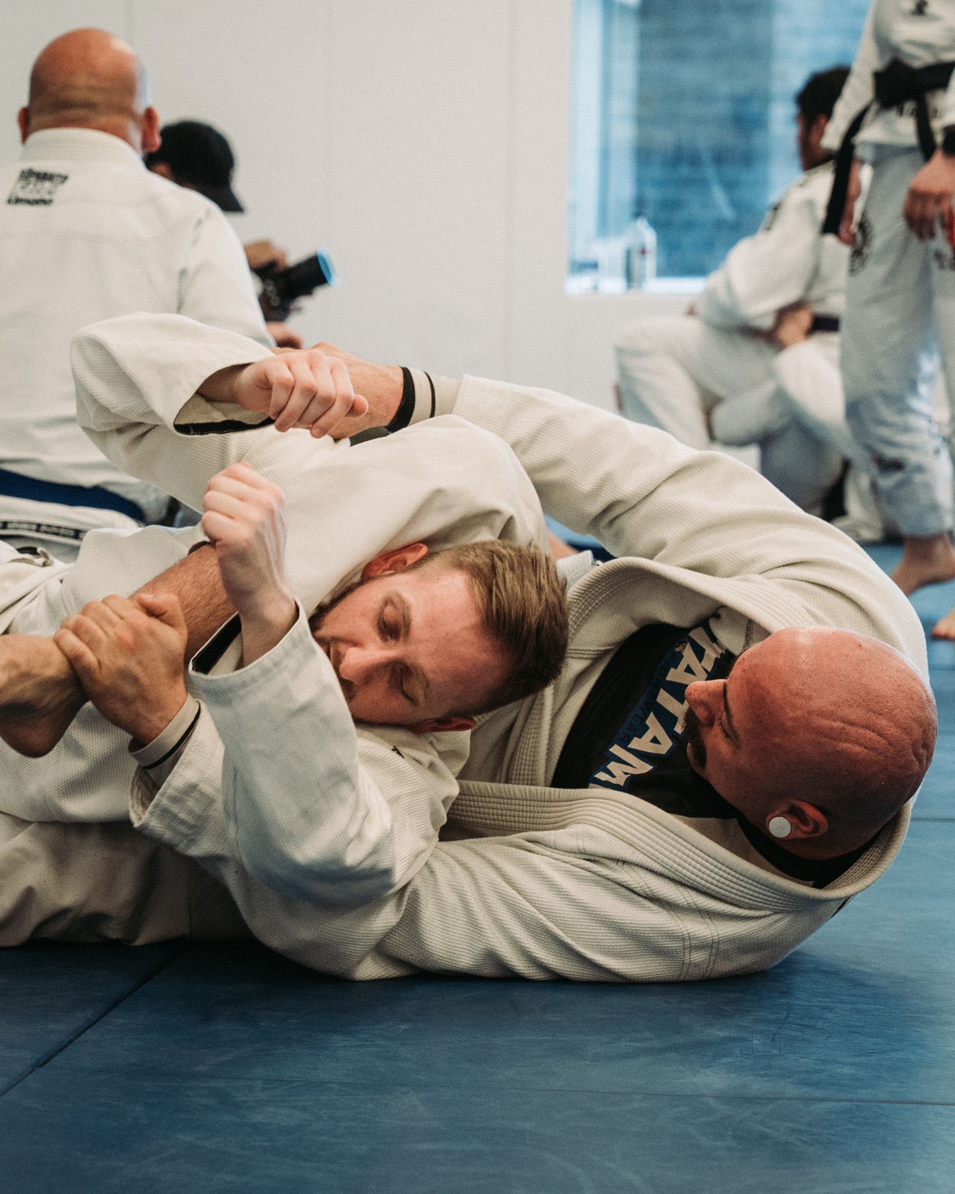 Adults practicing controlled Jiu-jitsu drills at Montgomery Brazilian Jiu-Jitsu in Montgomery, NJ.
