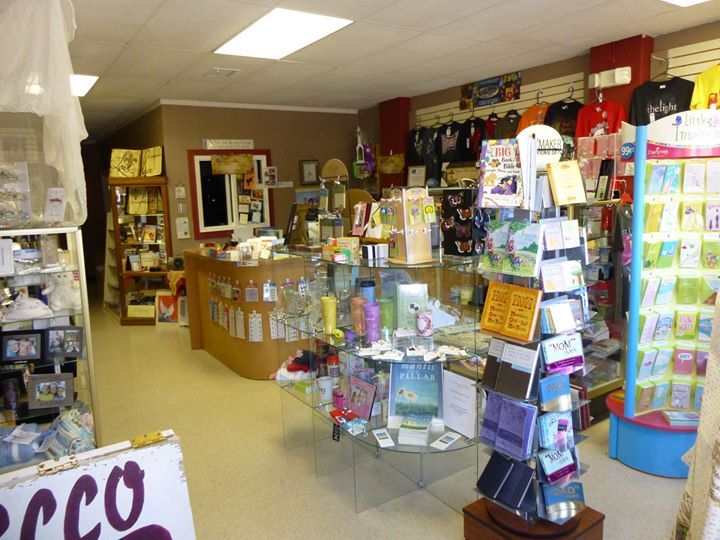 A store with a sign that says ECCO Family Bookstore on it.