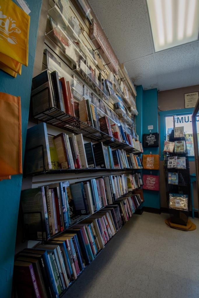 A book store with books stacked on shelves.