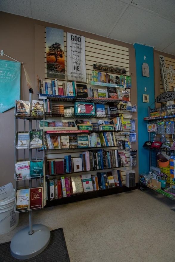 A display of books in a store with a sign that says 