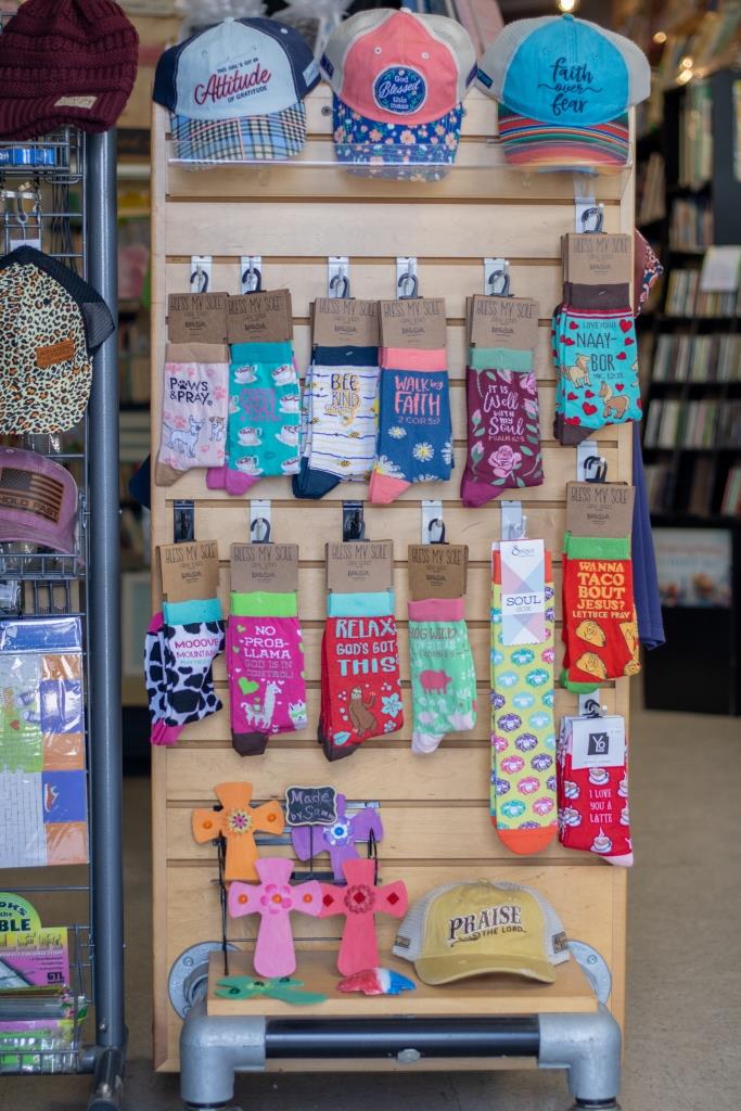 A display of socks and hats in a store.