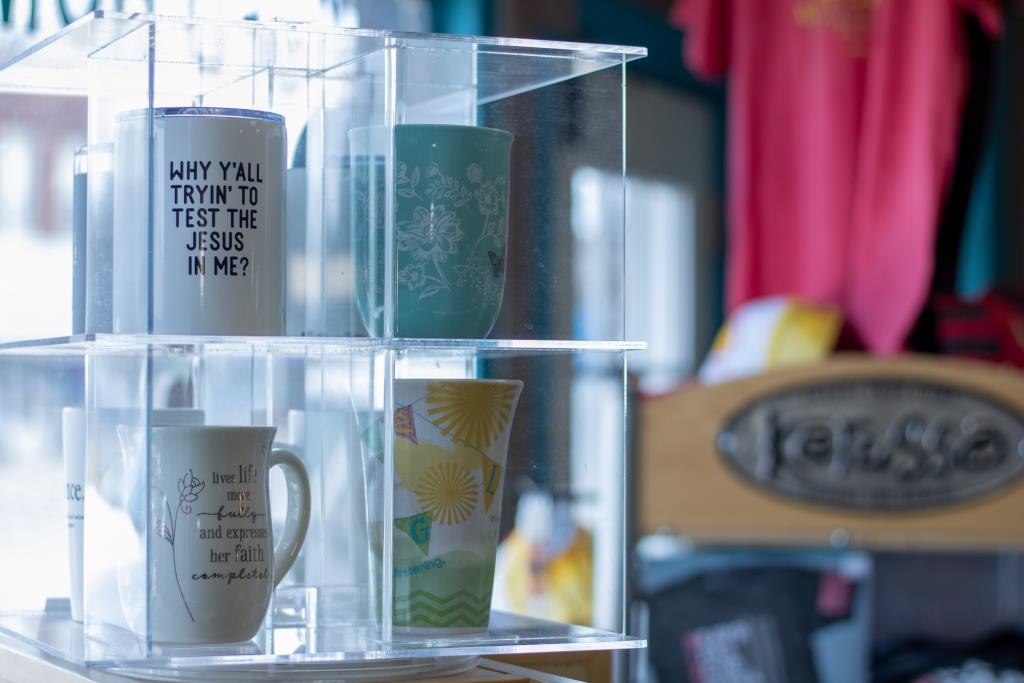 A display of mugs with one that says 