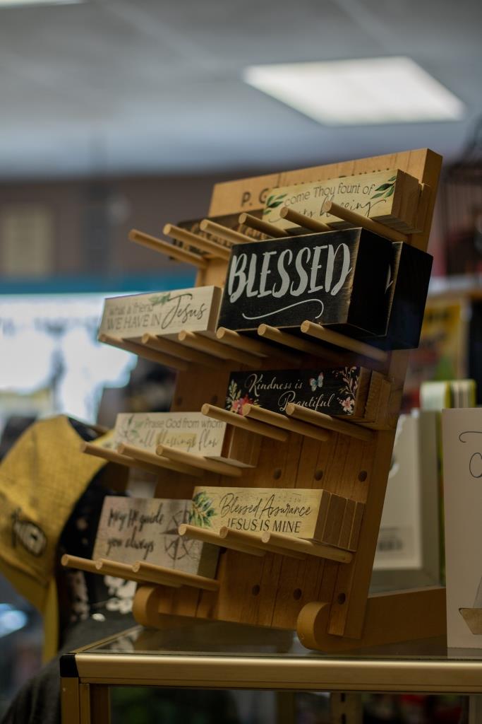 A wooden display with a box that says 'blessed' on it.