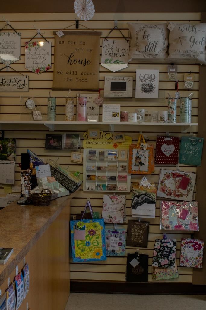 A store display with a sign that says 'I love you to the moon and back.'