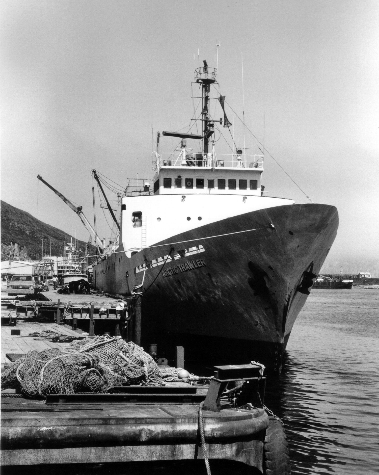 A black and white photo of a large ship with the letters aa on the side