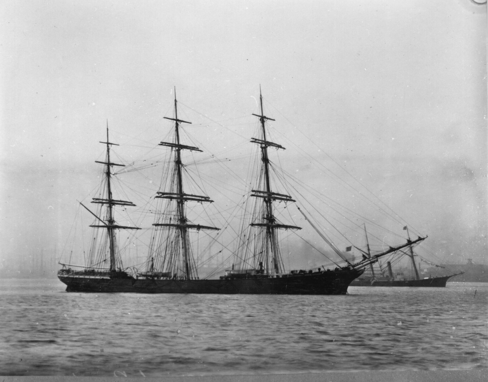 A black and white photo of a large ship in the water