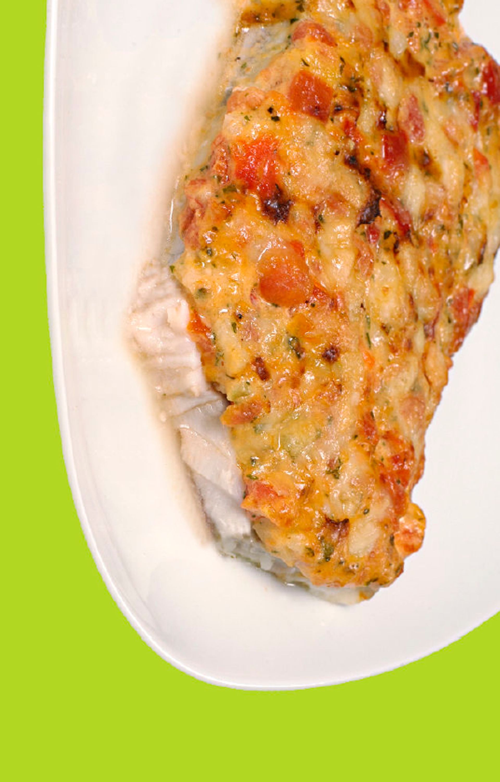 A close up of a plate of food on a green background.