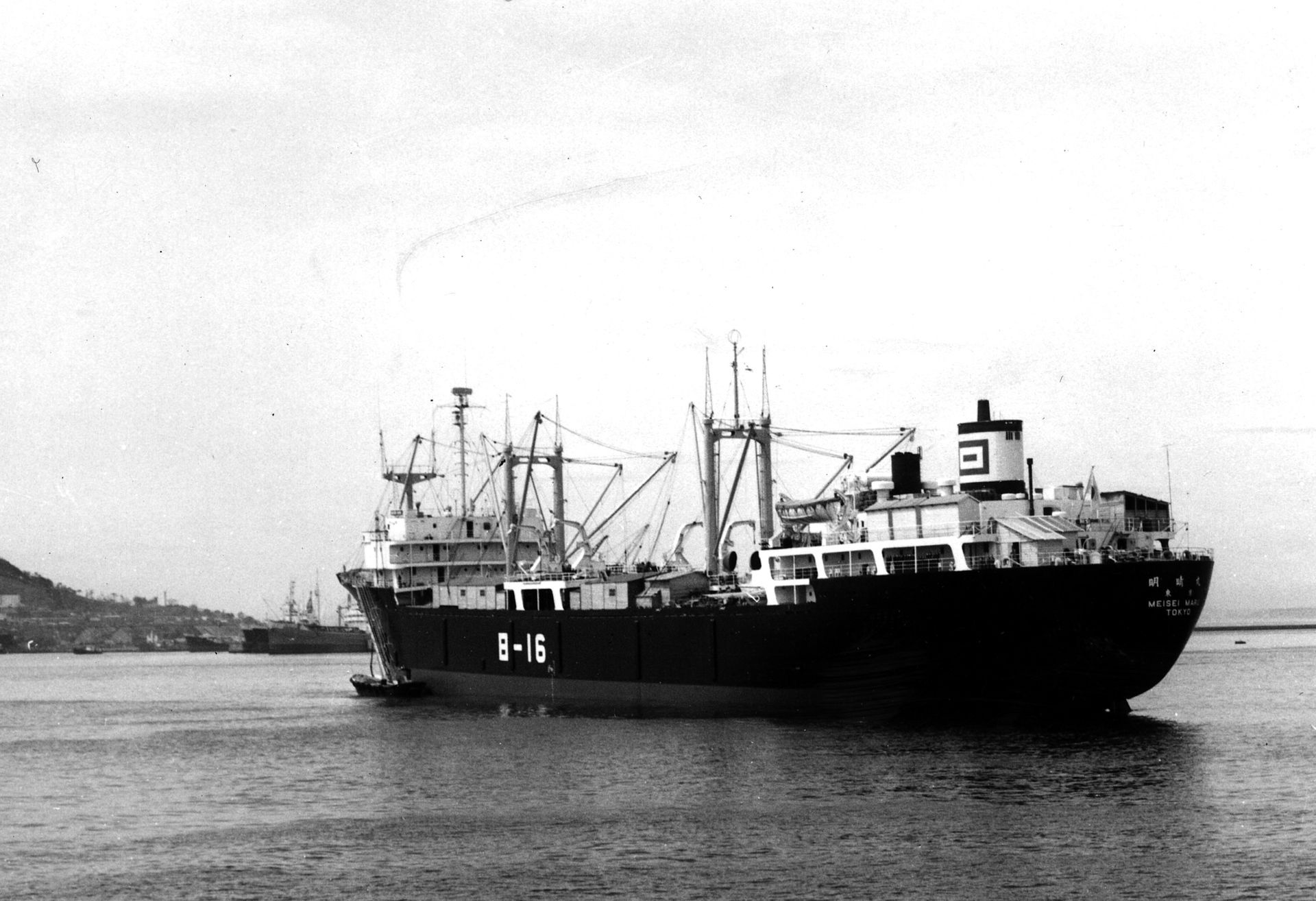 A black and white photo of a large ship with the number 3-16 on the side