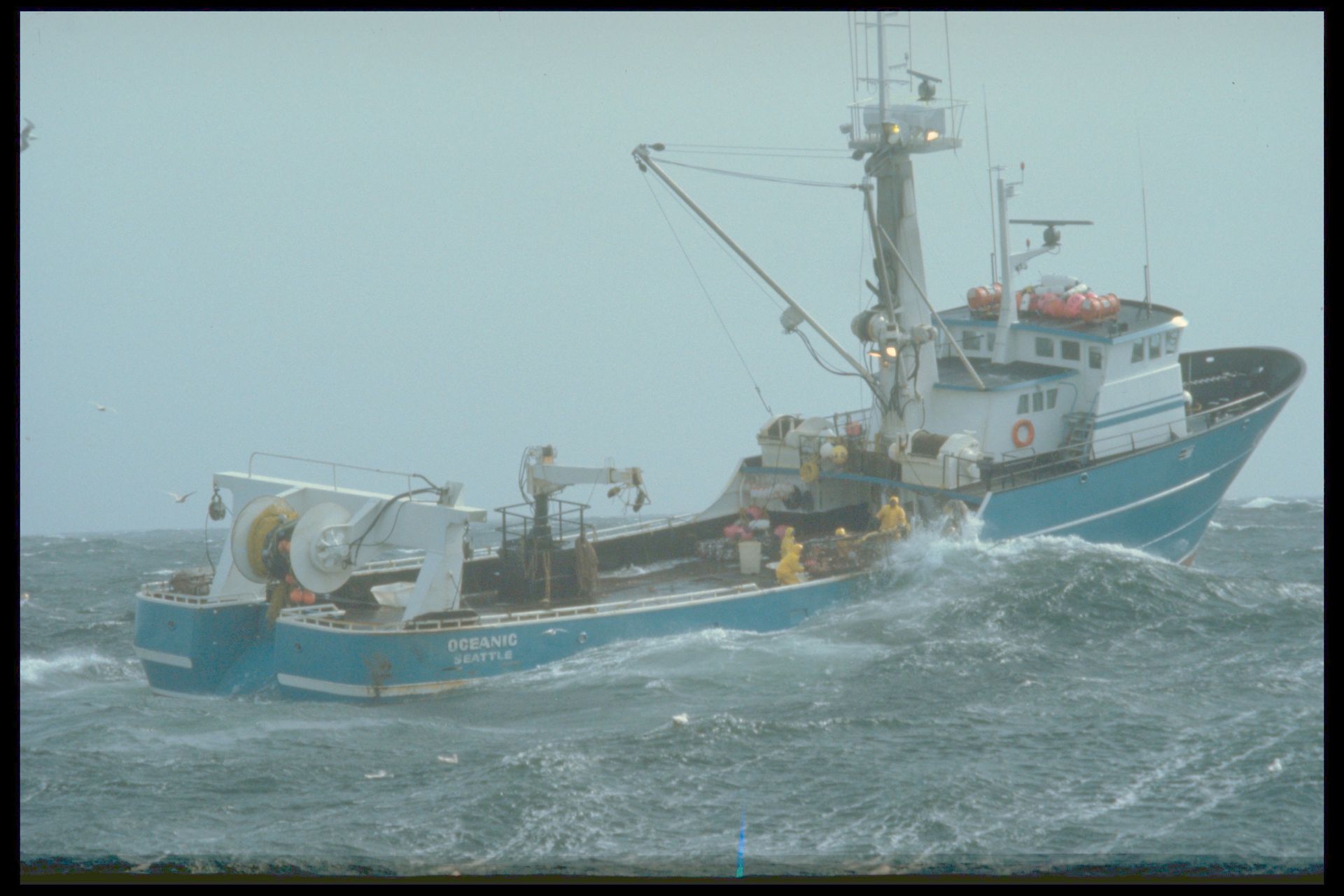 A large boat is floating on top of a large body of water.