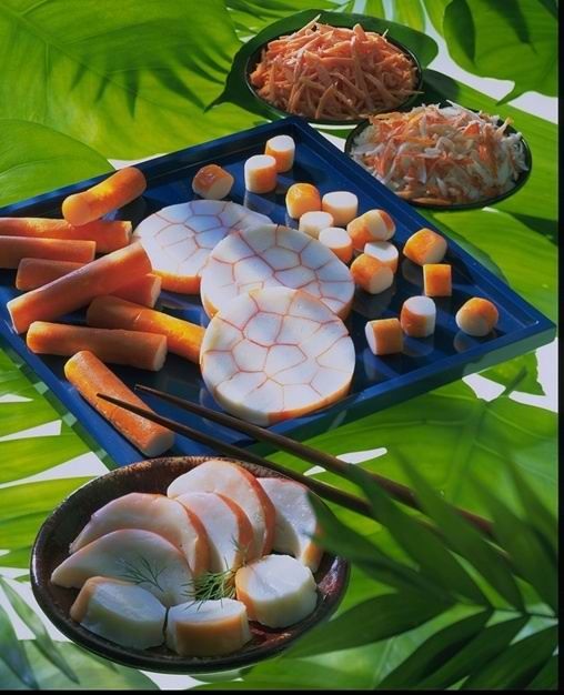 A tray of carrots and other vegetables with chopsticks