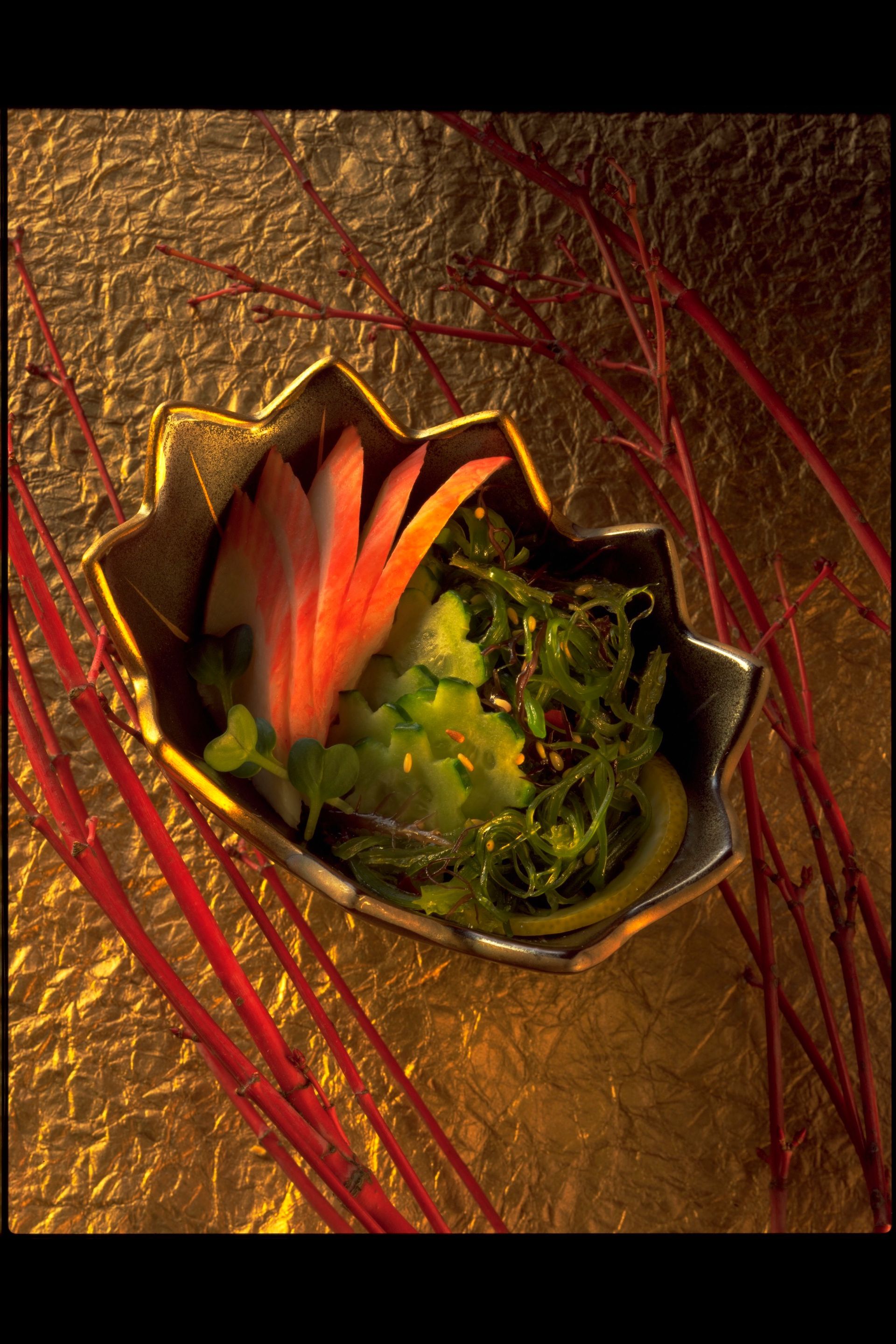 A bowl of food with a flower on top of it