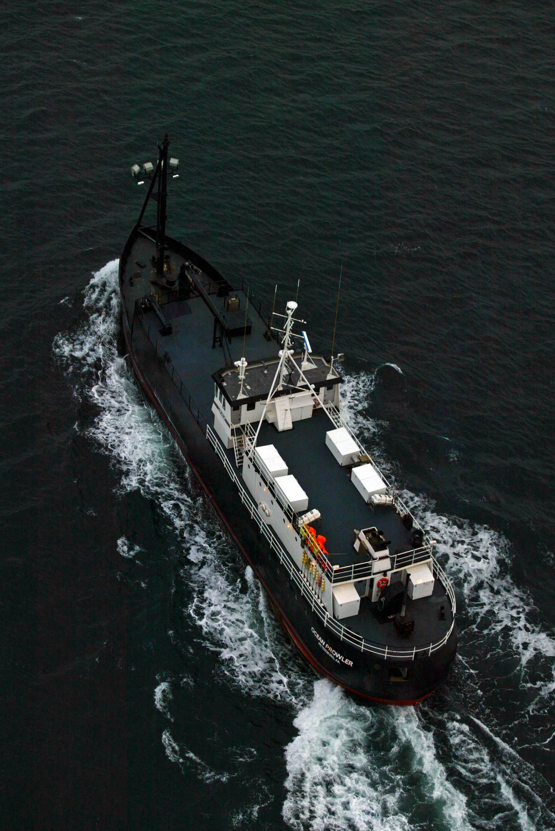A large ship is floating on top of a body of water