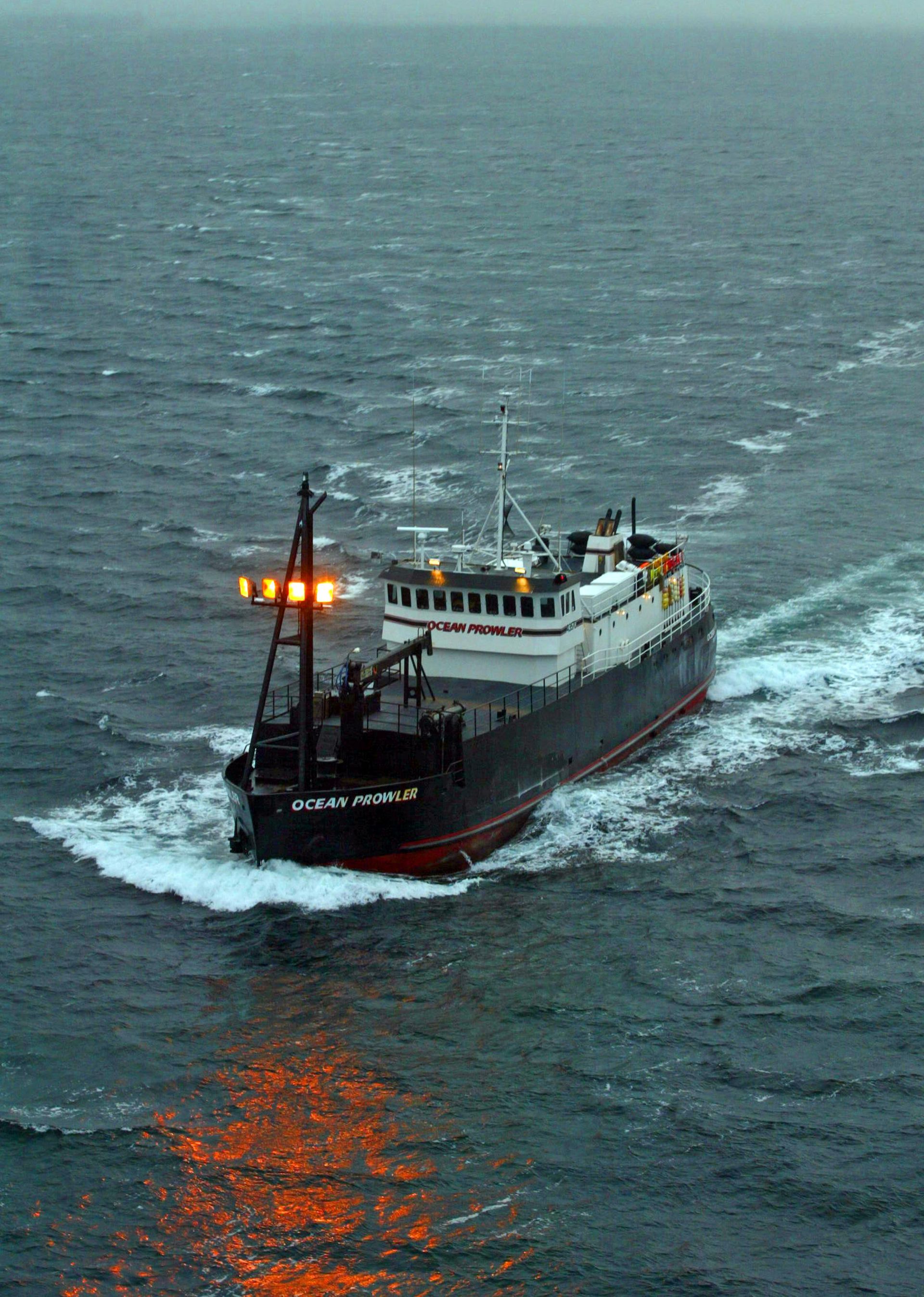 A large ship is floating on top of a large body of water.
