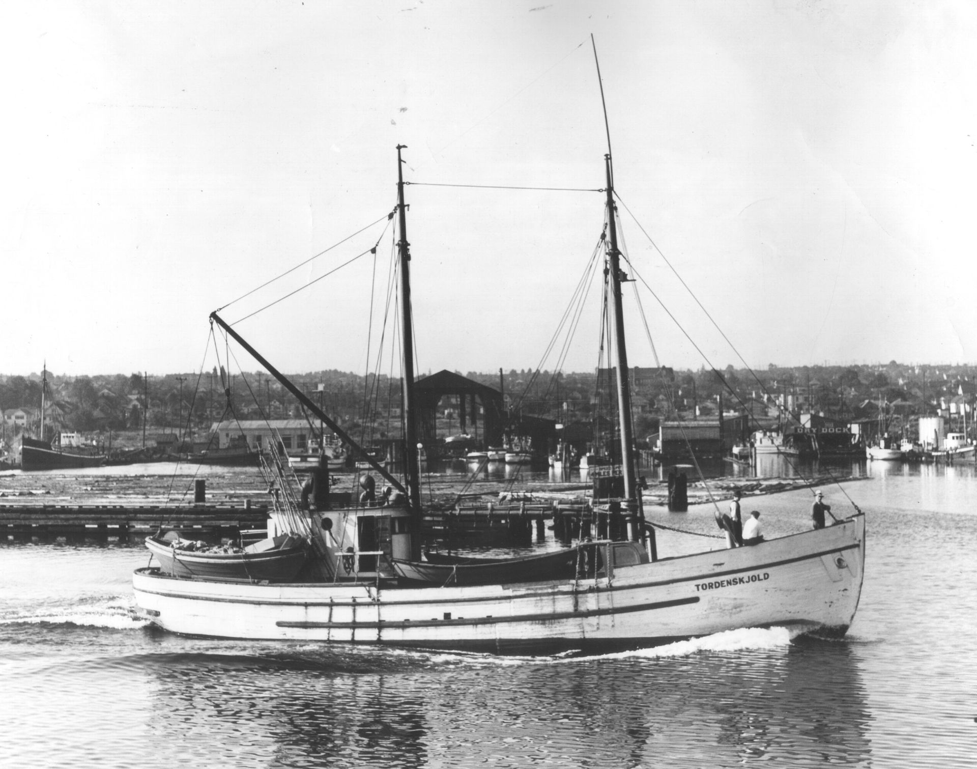 A black and white photo of a boat in the water