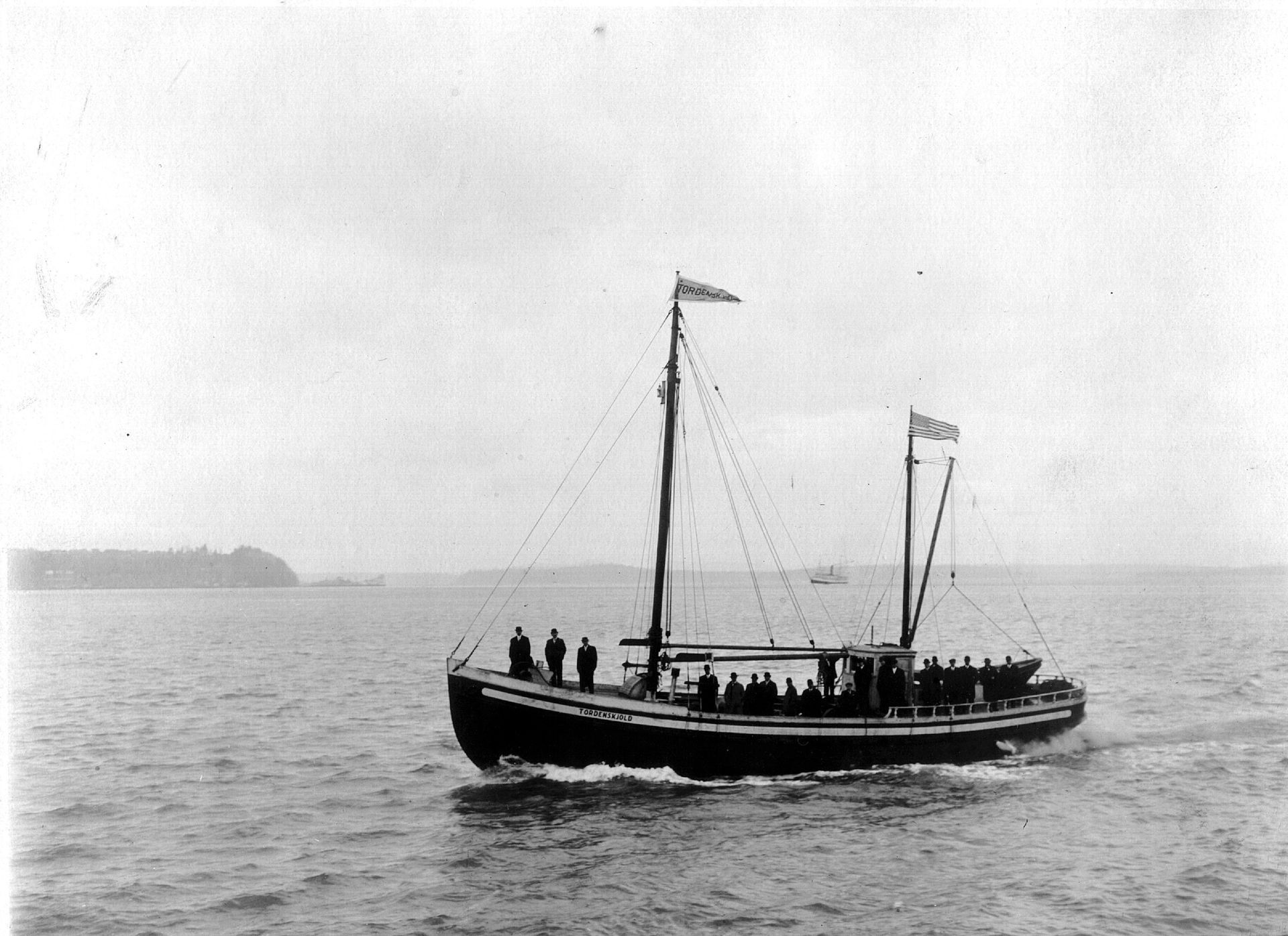 A black and white photo of a boat in the ocean