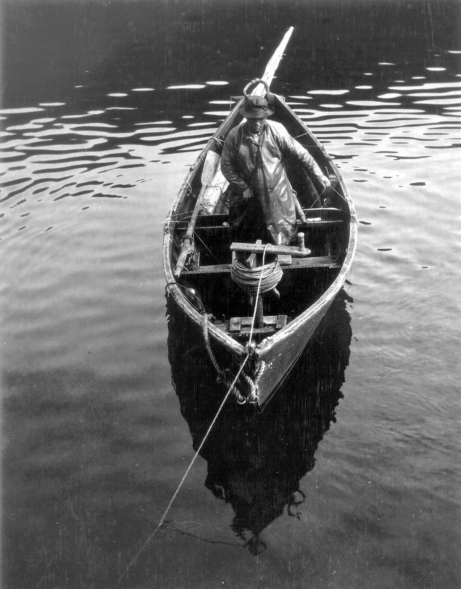 A black and white photo of a boat in the water
