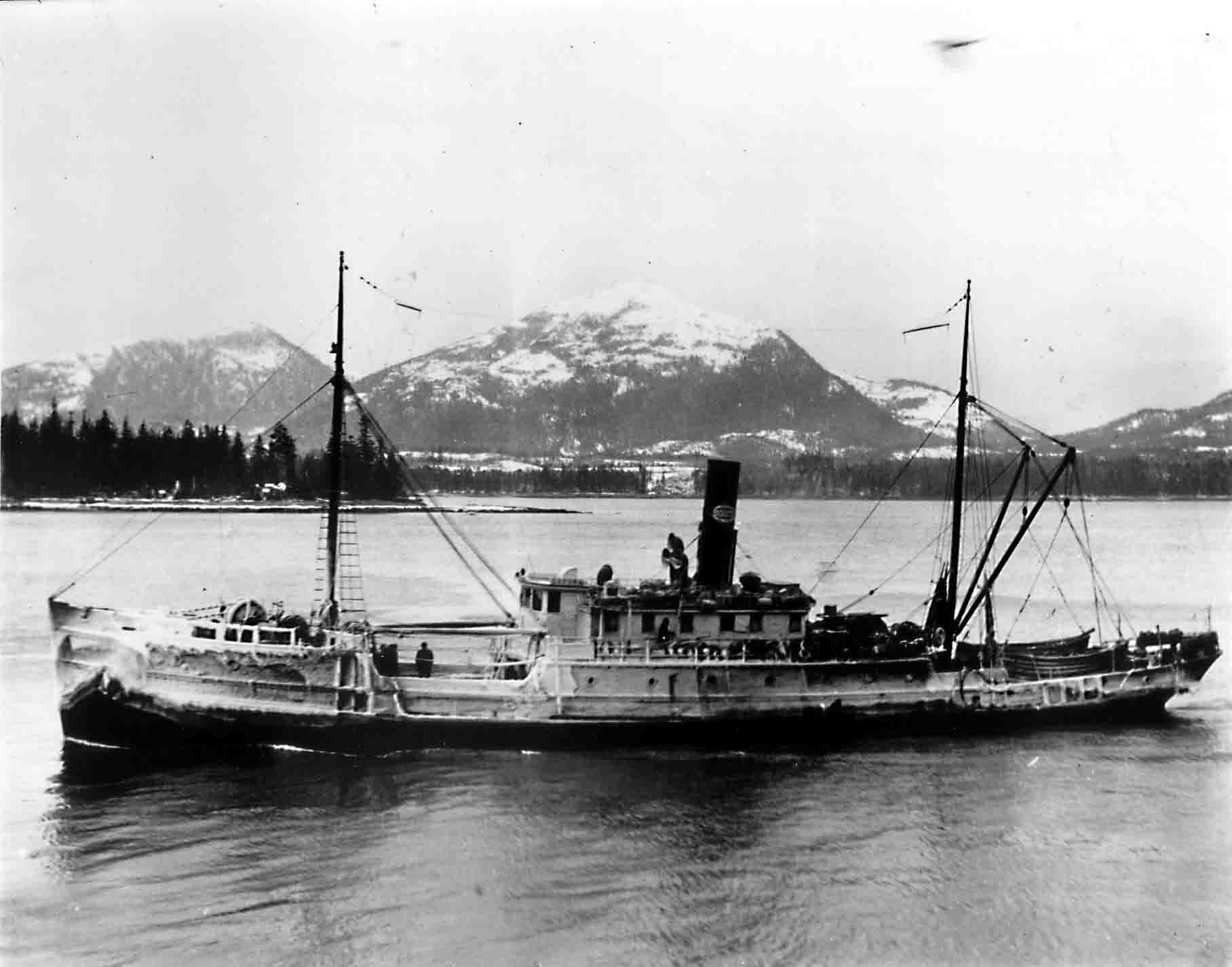 A black and white photo of a boat in the water