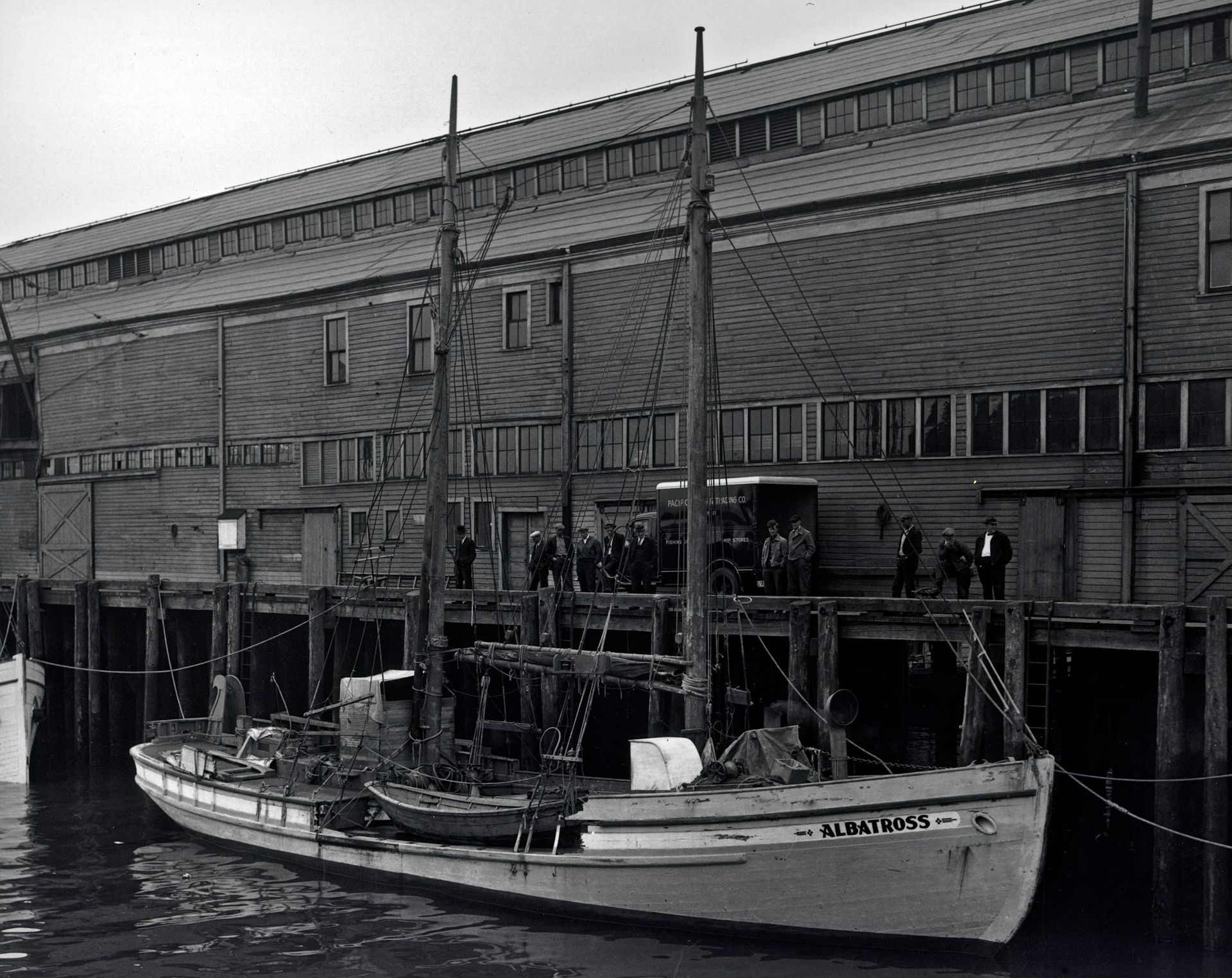 A black and white photo of a boat that says ' wisconsin ' on the side