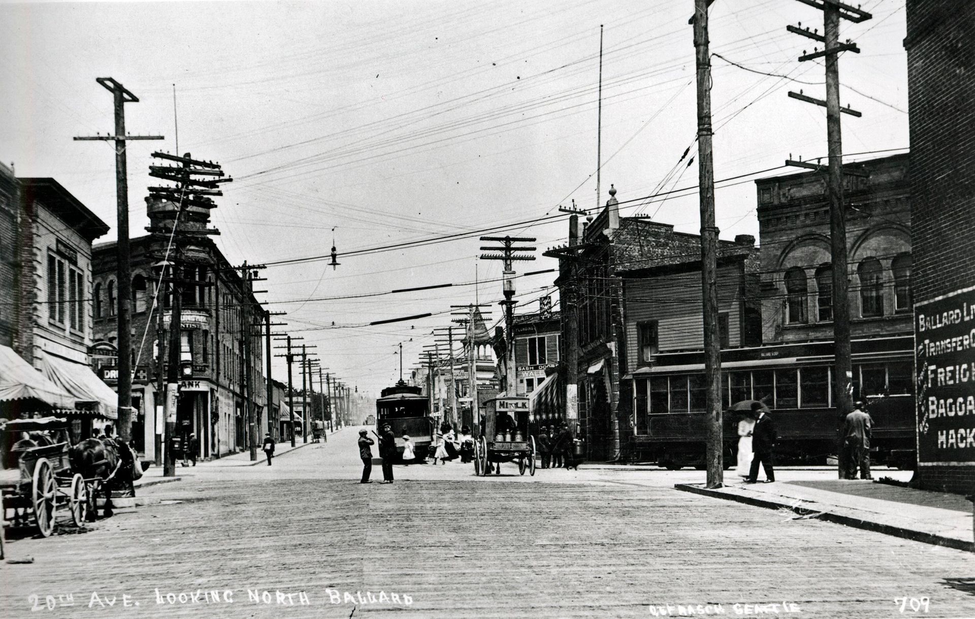A black and white photo of a city street with the number 924 on the bottom