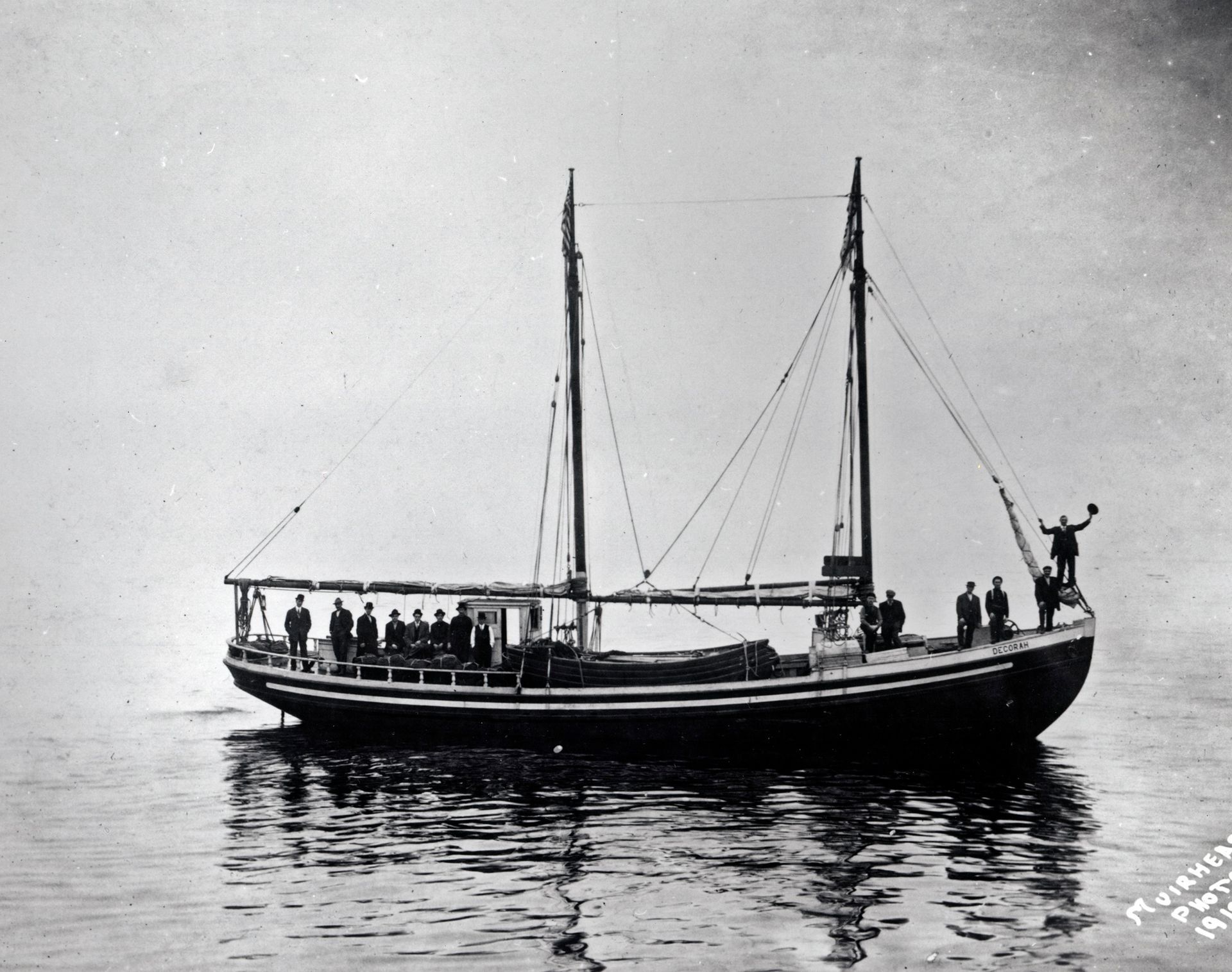 A black and white photo of a boat in the water