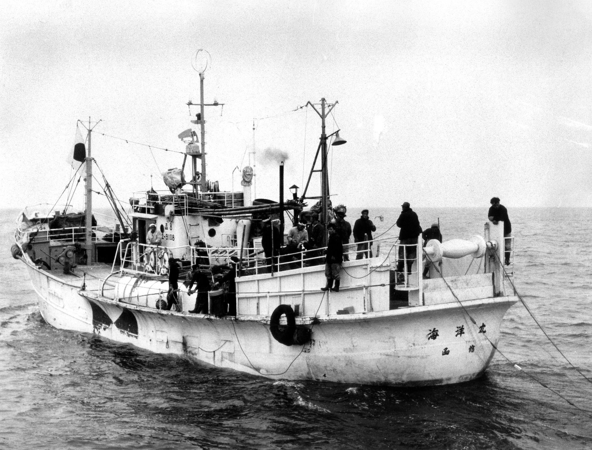 A black and white photo of a boat in the ocean