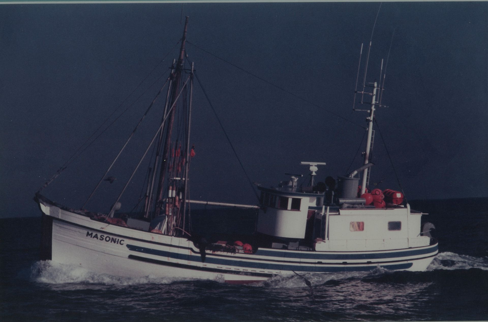 A boat with the name alfonso on the side of it