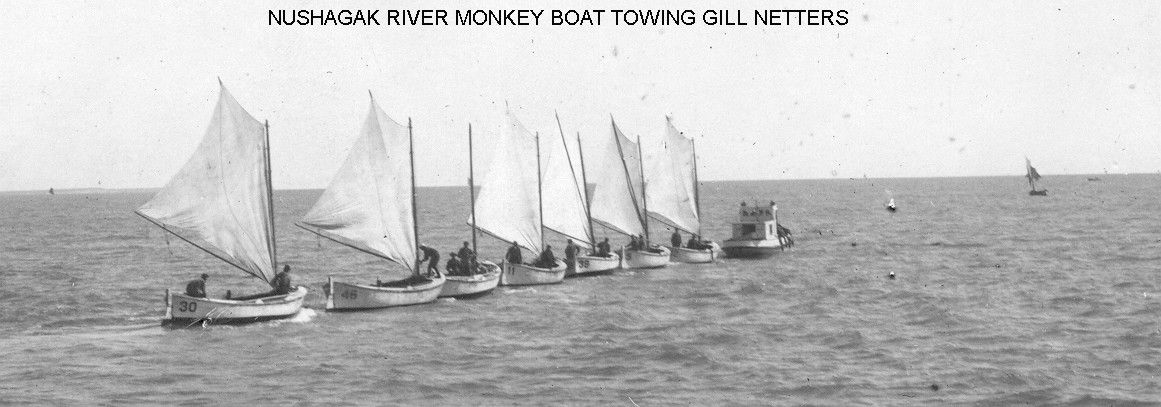 A black and white photo of sailboats in the ocean