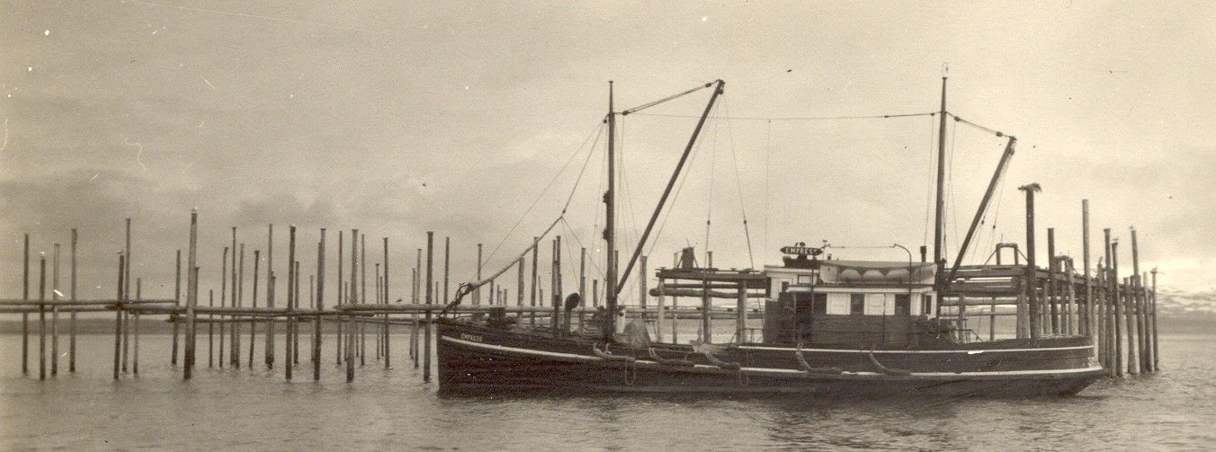 A black and white photo of a boat in the water