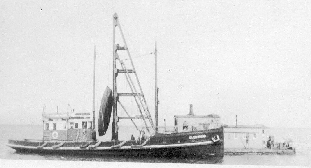 A black and white photo of a boat in the water